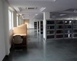 Reading area beside the library stacks at Asia Bhawan